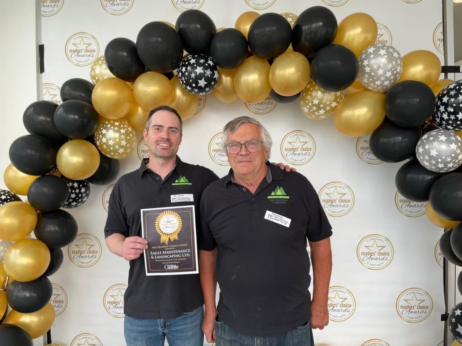 Eagle Maintenance & Landscaping accepting the 2023 Readers' Choice Award